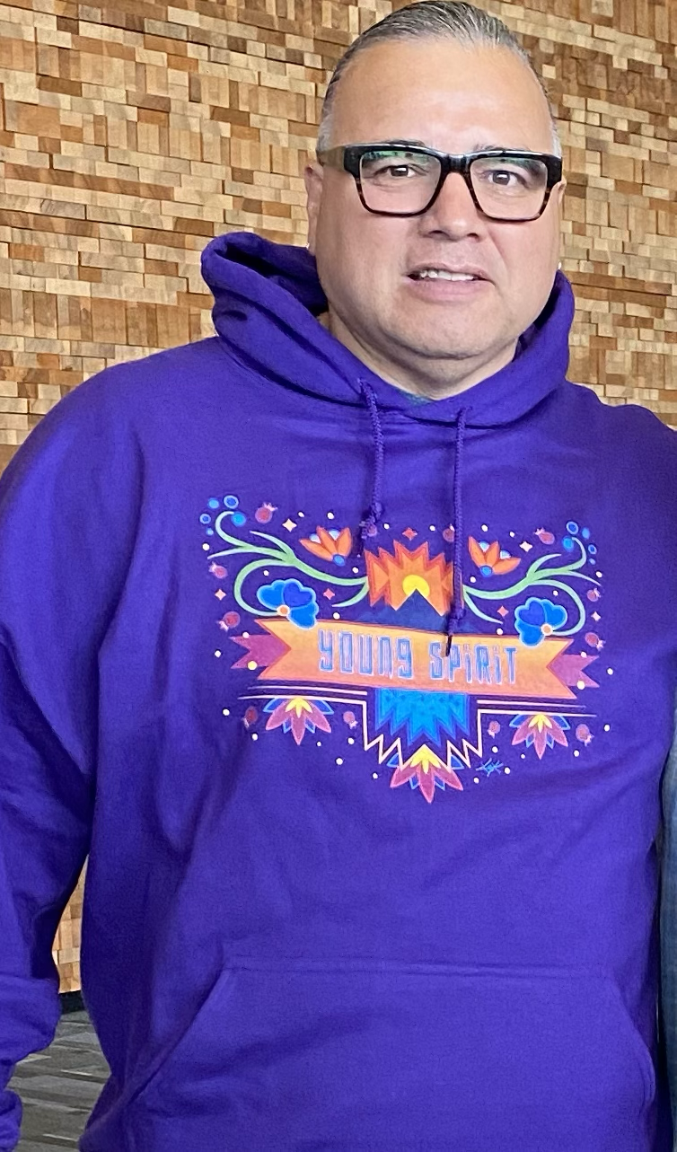 Delbert Wapass wearing a Young Spirit hoodie
